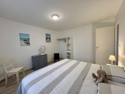 Un ou plusieurs lits dans un hébergement de l'établissement Appartement pour 4 pers. proche commerces et plage, idéal télétravail - FR-1-323-596