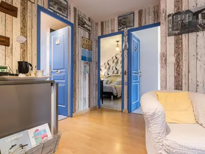Coin salon dans l'établissement Suite Familiale à Proximité de la Mer - FR-1-306-1331