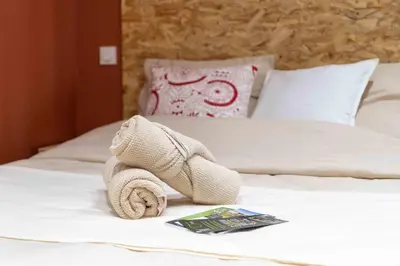 Un ou plusieurs lits dans un hébergement de l'établissement Studio Cosy, cœur de ville - Hyper Centre