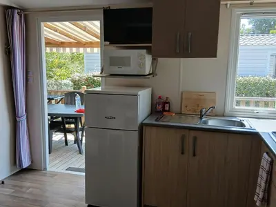 Cuisine ou kitchenette dans l'établissement Mon petit Paradis - Kabana Village