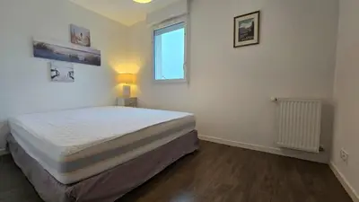 Un ou plusieurs lits dans un hébergement de l'établissement Maison calme et lumineuse à proximité des plages de Pornic