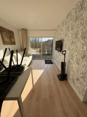 Télévision ou salle de divertissement dans l'établissement Logement neuf 4 personnes Proche centre-bourg