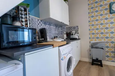 Cuisine ou kitchenette dans l'établissement Athos Confort & calme près du Puy du Fouu