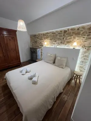 Un ou plusieurs lits dans un hébergement de l'établissement Gite le moulin du Roho
