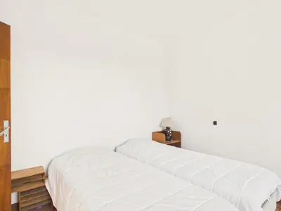 Un ou plusieurs lits dans un hébergement de l'établissement Maison tout confort pour 8 avec jardin