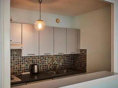 Cuisine ou kitchenette dans l'établissement Face océan, appartement panoramique