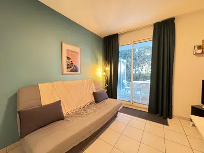 Coin salon dans l'établissement L'Embrun - TV, WiFi, Parking, Piscine de résidence