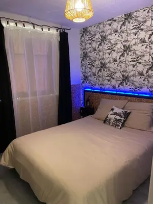 Un ou plusieurs lits dans un hébergement de l'établissement Maison une chambre