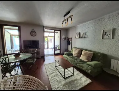 Coin salon dans l'établissement Maison cosy proche plage