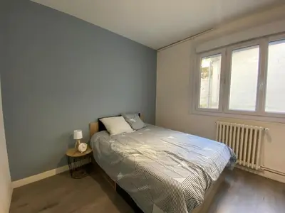 Un ou plusieurs lits dans un hébergement de l'établissement Appartement T4 - 3 chambres