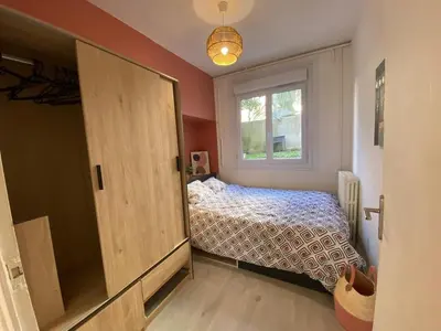 Un ou plusieurs lits dans un hébergement de l'établissement Appartement T4 - 3 chambres