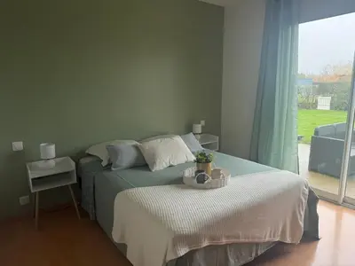 Un ou plusieurs lits dans un hébergement de l'établissement La Parenthèse, Maison lumineuse avec jardin & grande terrasse proche du Puy duFou