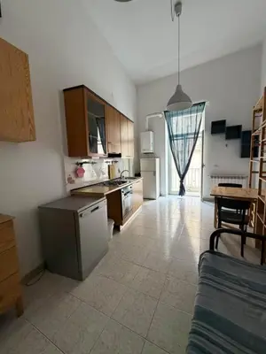 Cuisine ou kitchenette dans l'établissement Noble Square Apartment