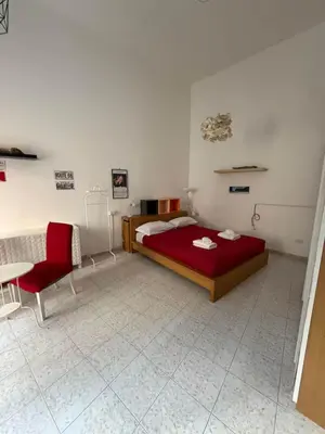 Un ou plusieurs lits dans un hébergement de l'établissement Noble Square Apartment