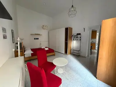 Un ou plusieurs lits dans un hébergement de l'établissement Noble Square Apartment