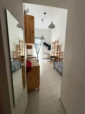 Un ou plusieurs lits dans un hébergement de l'établissement Noble Square Apartment