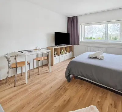 Un ou plusieurs lits dans un hébergement de l'établissement Studio rénové proche Nantes idéal séjour pro