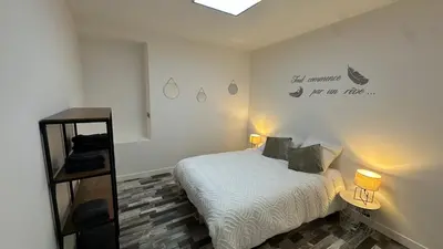 Un ou plusieurs lits dans un hébergement de l'établissement Maison cosy proche Aéroport de Nantes