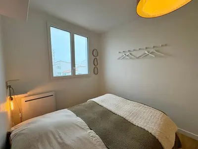Un ou plusieurs lits dans un hébergement de l'établissement Éclatant Apt 5 pers avec Balcon et Garage - FR-1-323-599