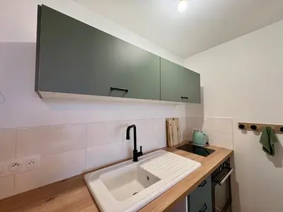 Cuisine ou kitchenette dans l'établissement Éclatant Apt 5 pers avec Balcon et Garage - FR-1-323-599