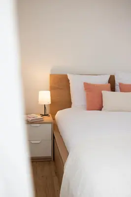 Un ou plusieurs lits dans un hébergement de l'établissement Cozy Apartment Nantes Polyclinic Zenith