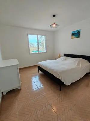 Un ou plusieurs lits dans un hébergement de l'établissement Les Mains Dorées Gîte