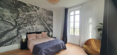 Un ou plusieurs lits dans un hébergement de l'établissement Les chambres du Manoir
