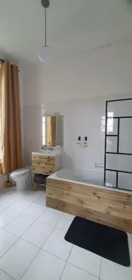 Un ou plusieurs lits dans un hébergement de l'établissement Les chambres du Manoir