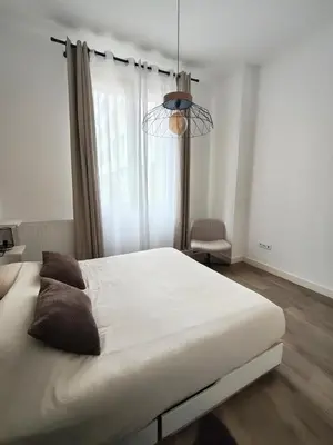 Un ou plusieurs lits dans un hébergement de l'établissement Superbe appartement aux machines de l'île