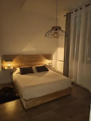 Un ou plusieurs lits dans un hébergement de l'établissement Superbe appartement aux machines de l'île