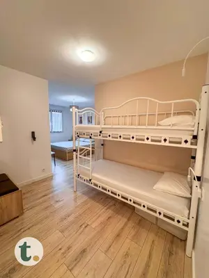 Un ou plusieurs lits dans un hébergement de l'établissement Tranquiloue - Gite 15 personnes - 10min Puy du Fou