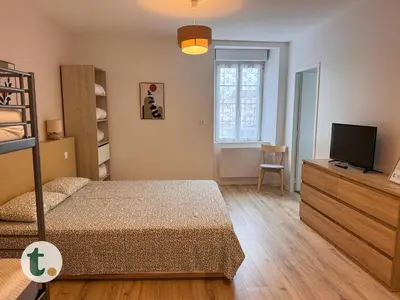 Un ou plusieurs lits dans un hébergement de l'établissement Tranquiloue - Suite Familiale - 10min Puy du Fou