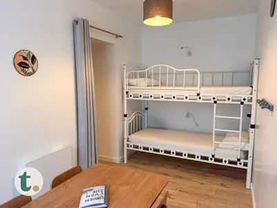 Un ou plusieurs lits dans un hébergement de l'établissement Tranquiloue - Suite Familiale - 10min Puy du Fou