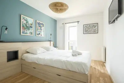 Un ou plusieurs lits dans un hébergement de l'établissement Appartement lumineux et calme au pied des Machines