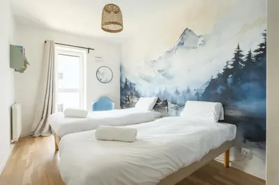 Un ou plusieurs lits dans un hébergement de l'établissement Appartement lumineux et calme au pied des Machines
