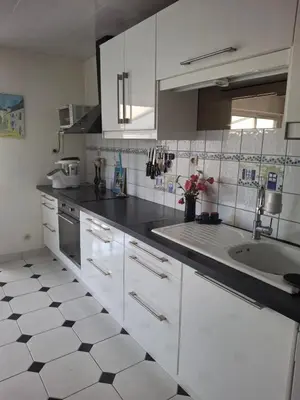 Cuisine ou kitchenette dans l'établissement chambre ensoleillée