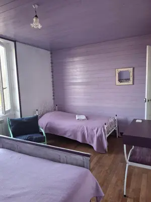 Un ou plusieurs lits dans un hébergement de l'établissement chambre ensoleillée