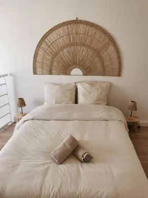 Un ou plusieurs lits dans un hébergement de l'établissement Les Cotonniers, duplex cosy
