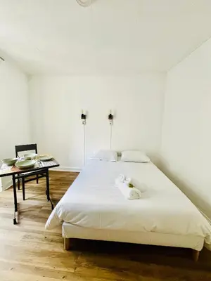 Un ou plusieurs lits dans un hébergement de l'établissement Apparthotel Beauregard 12 cœur de Nantes WIFI