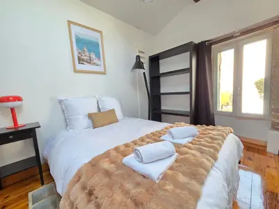 Un ou plusieurs lits dans un hébergement de l'établissement La Maison de l'Île, calme & atypique, proche Loire