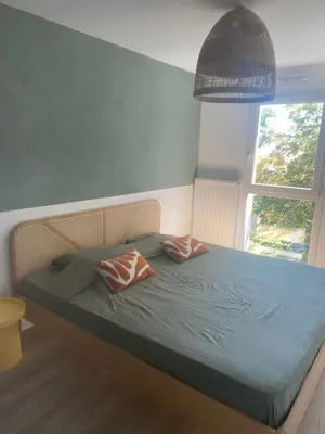 Un ou plusieurs lits dans un hébergement de l'établissement Maison 2 chambres