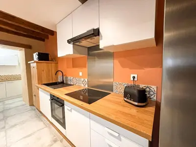 Cuisine ou kitchenette dans l'établissement Authentique Gîte en Pierre - 17 min du Parc
