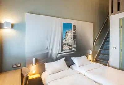 Un ou plusieurs lits dans un hébergement de l'établissement B&B HOTEL Angers 1 Beaucouzé