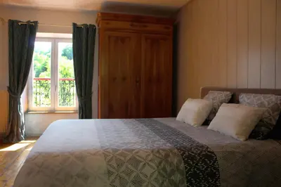 Un ou plusieurs lits dans un hébergement de l'établissement Moulin Pont Vieux Chambres d'hôtes