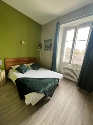 Un ou plusieurs lits dans un hébergement de l'établissement Hôtel de Bretagne
