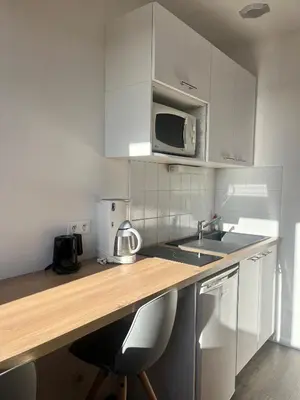 Cuisine ou kitchenette dans l'établissement Hôtel de Bretagne