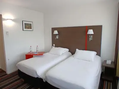 Un ou plusieurs lits dans un hébergement de l'établissement ibis Styles Segre