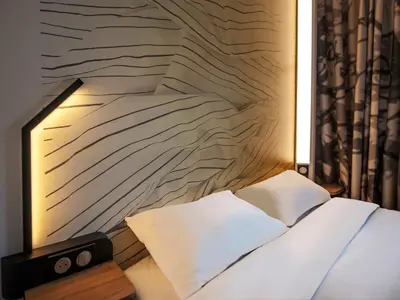 Un ou plusieurs lits dans un hébergement de l'établissement B&B HOTEL Cholet Nord