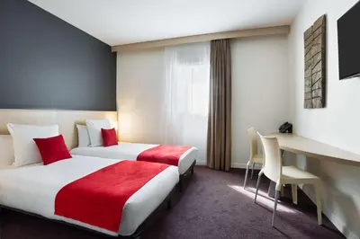 Un ou plusieurs lits dans un hébergement de l'établissement Sure Hotel by Best Western Nantes Beaujoire