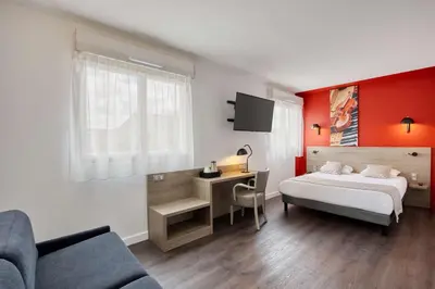 Un ou plusieurs lits dans un hébergement de l'établissement Best Western Hotel Atlantys Zenith Nantes